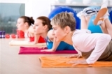 women exercising on mat